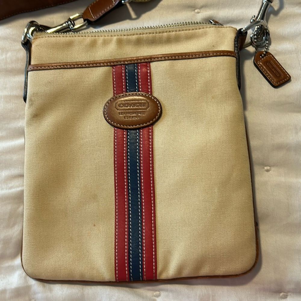 Coach , beige tan color w/ red & blue stripes